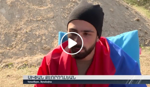 Armenian volunteers from the Diaspora, reported as "mercenaries" in Azerbaijani fake news, are in Armenia holding the New Testament in hands