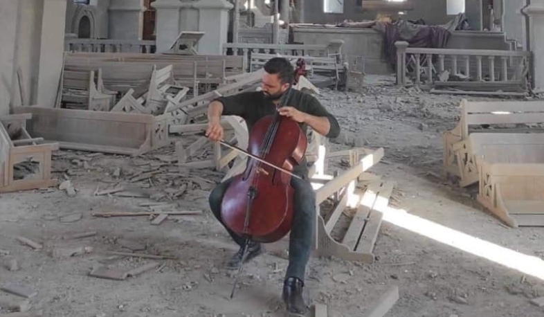 Armenian musician from Belgium plays the cello in the ruined Church of Ghazanchetsots. VIDEO
